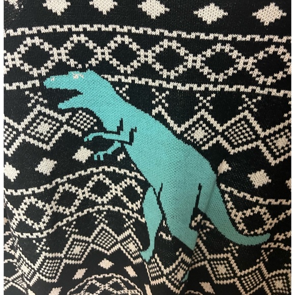 Black and white sweater with a teal colored dinosaur. - Picture 3 of 4